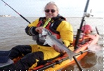 A Kayak Fisherman with a fish